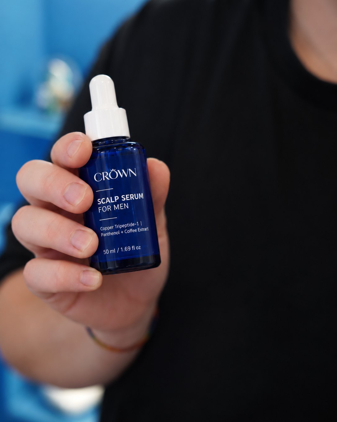 CROWN Scalp Serum for Men, 50 ml bottle held in hand